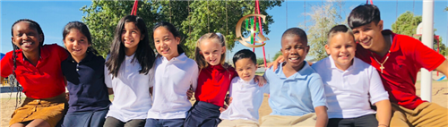 A row of students on a playground.